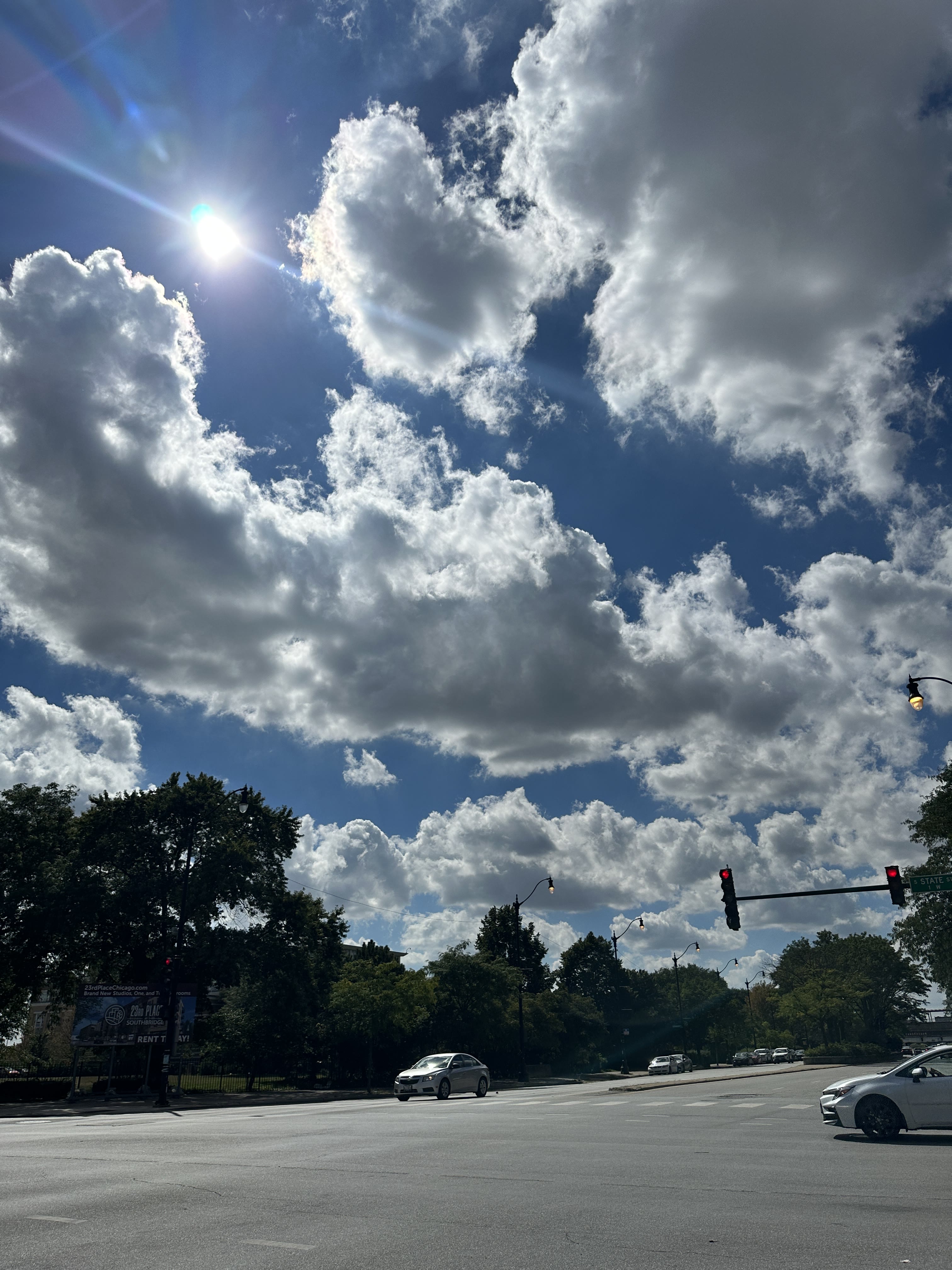 Bright clouds above a city intersection
