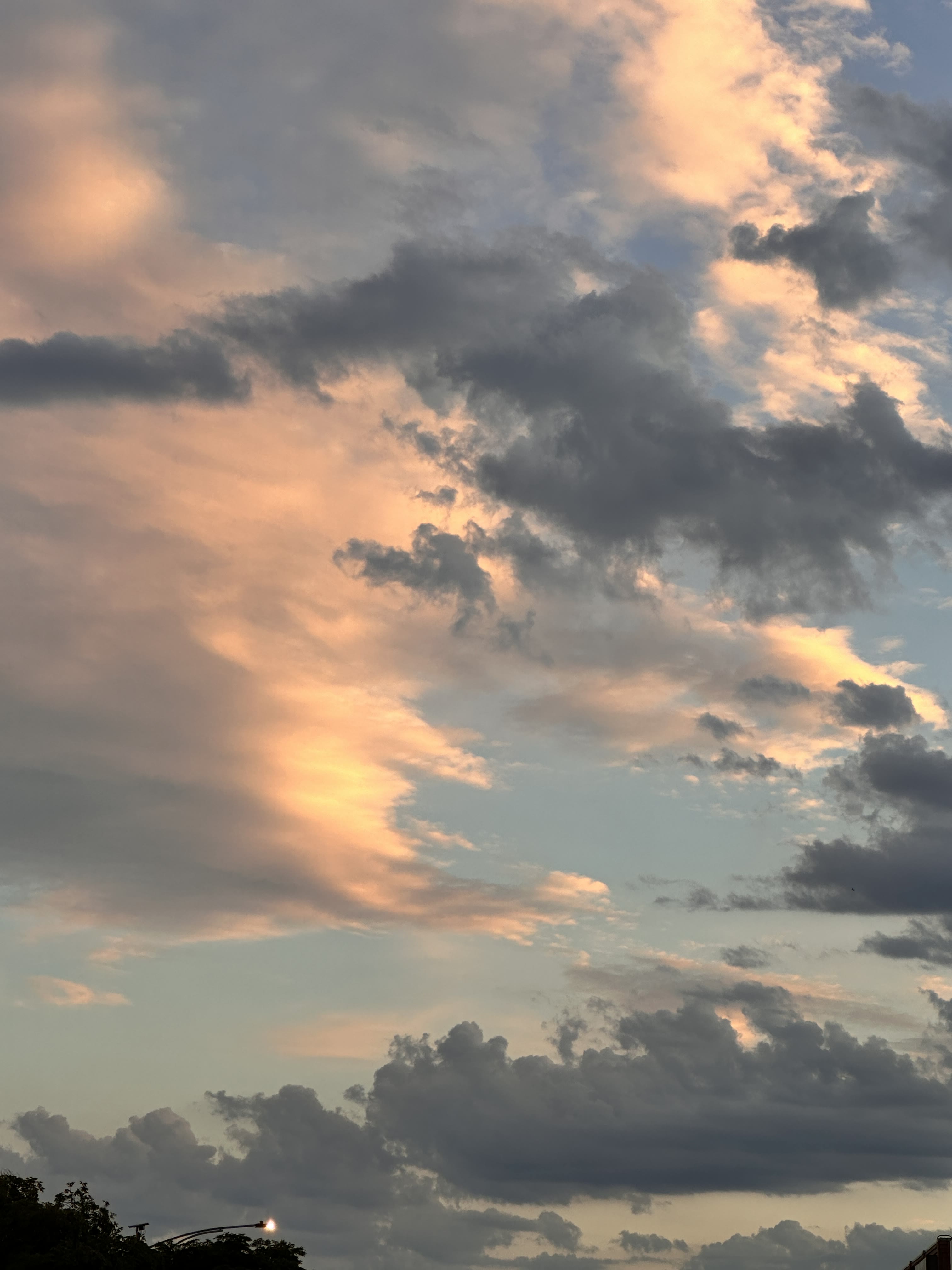 Peach-colored clouds in an evening sky